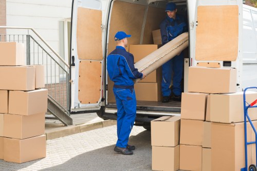 Office removals in Paddington planning with moving boxes and desks