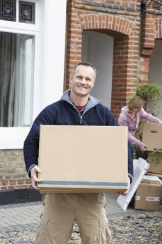 Moving team preparing items safely with protective padding in Paddington