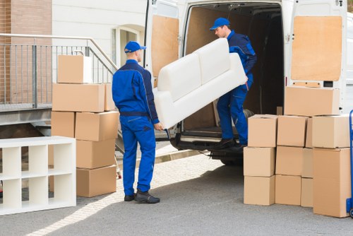 Removal van loading goods into a vehicle