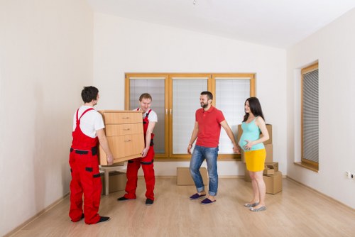 Professional movers checking secure cargo inside a removal van