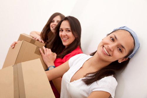 Professional movers carefully loading boxes during a Paddington house relocation