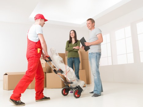 Furniture removal team planning a move in Paddington with equipment and trolleys