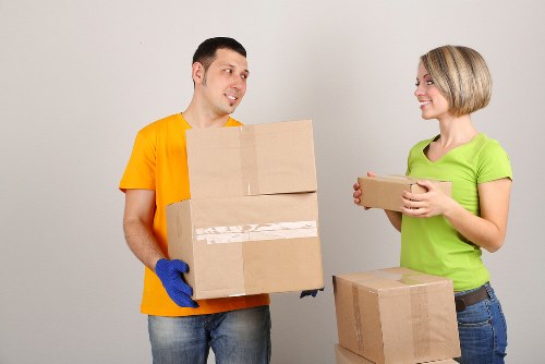 A moving team protecting furniture inside a Paddington terrace home