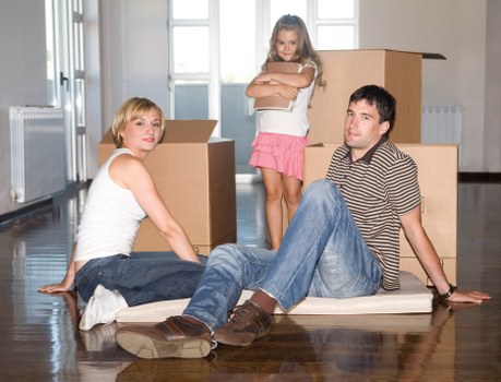 Professional movers loading a van for a same day Paddington move